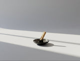 Black ceramic incienso palo santo holder with white geometric patterns. Handmade in Peru. Andina World